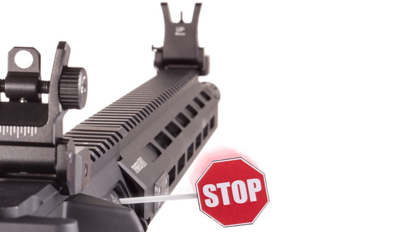 AR-15 with "Stop" flag in breech